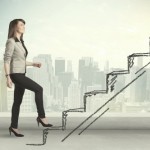 Business woman climbing up on hand drawn staircase concept